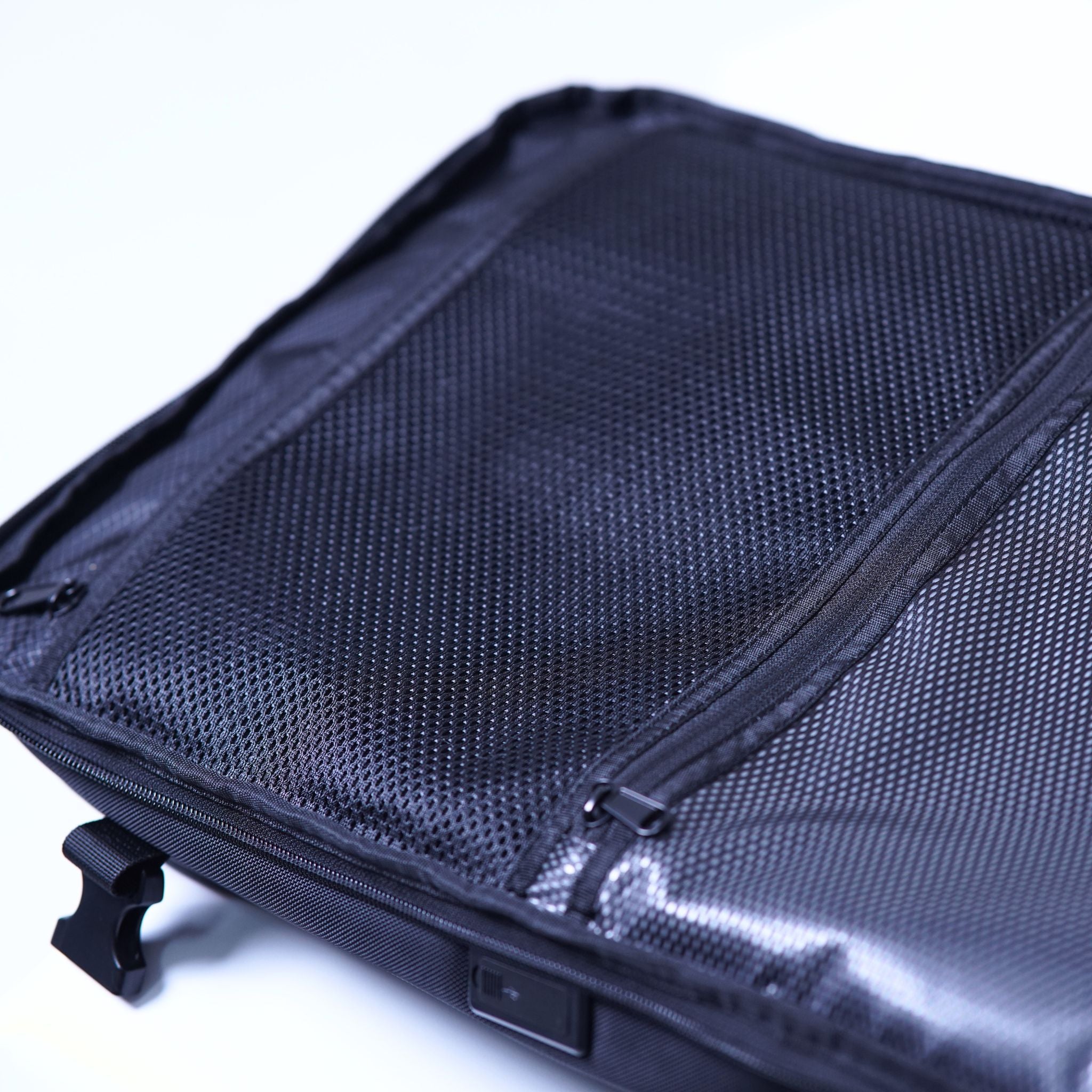 Interior view of the MEGABACK Trolley Vacuum Backpack showing two zippered compartments, one of which is waterproof.