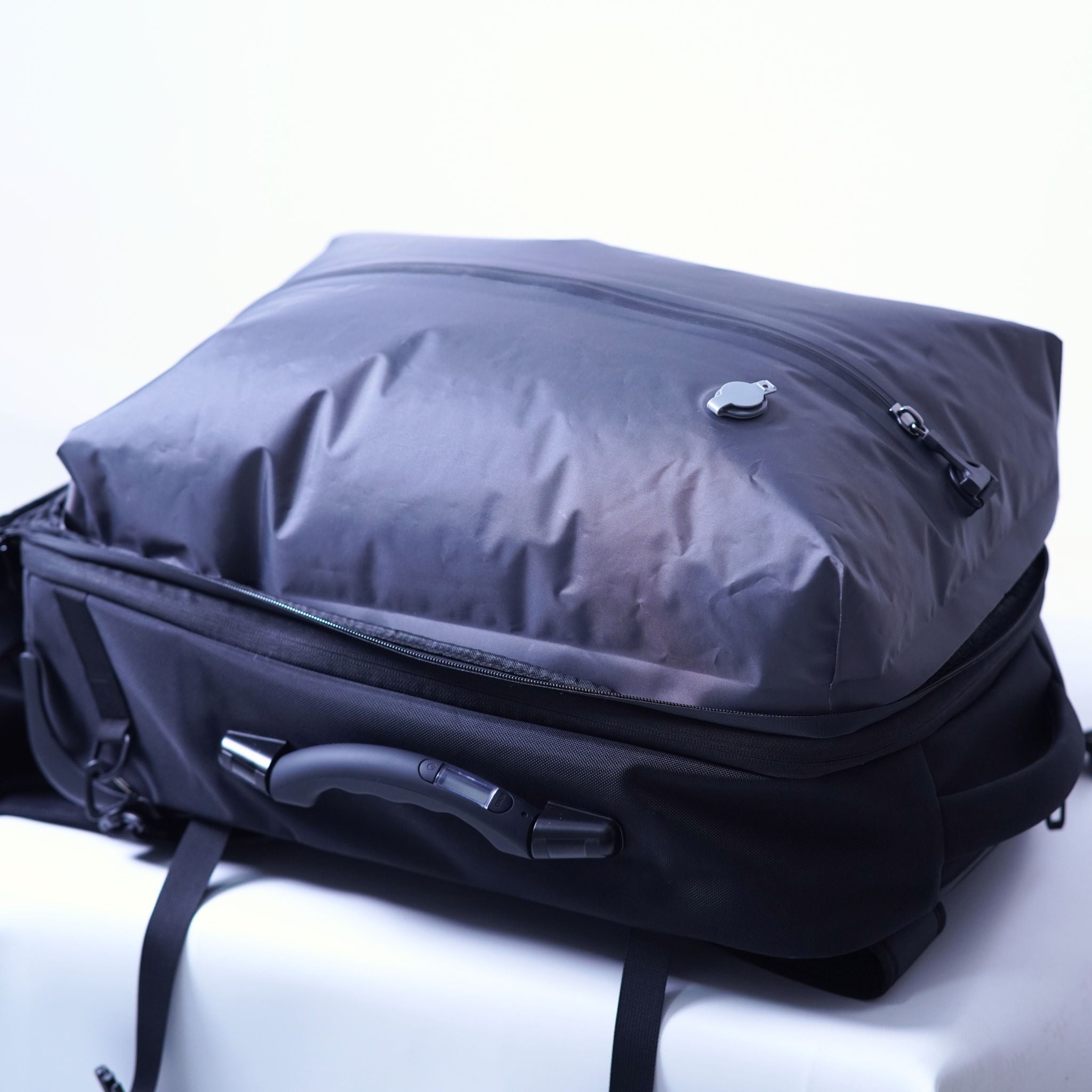 Interior view of the Vacuum Backpack showing a removable compressible compartment, highlighting its flexible packing options.